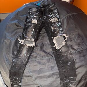 AMIRI Black Distressed Skinny Jeans with White Accents